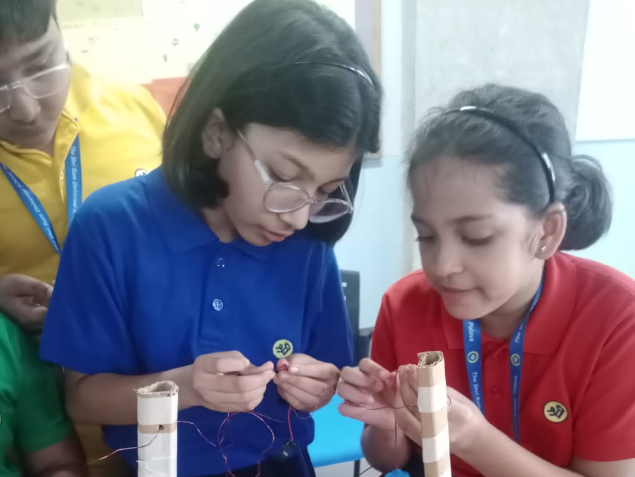 Girls participating in a STEM activity at Curiosity Gym