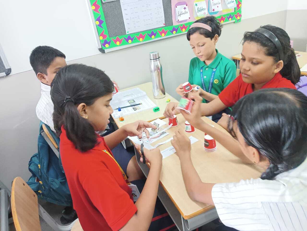 Girls building robots at Curiosity Gym